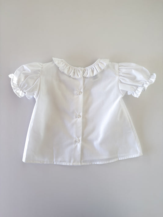 White Ruffle Button Blouse