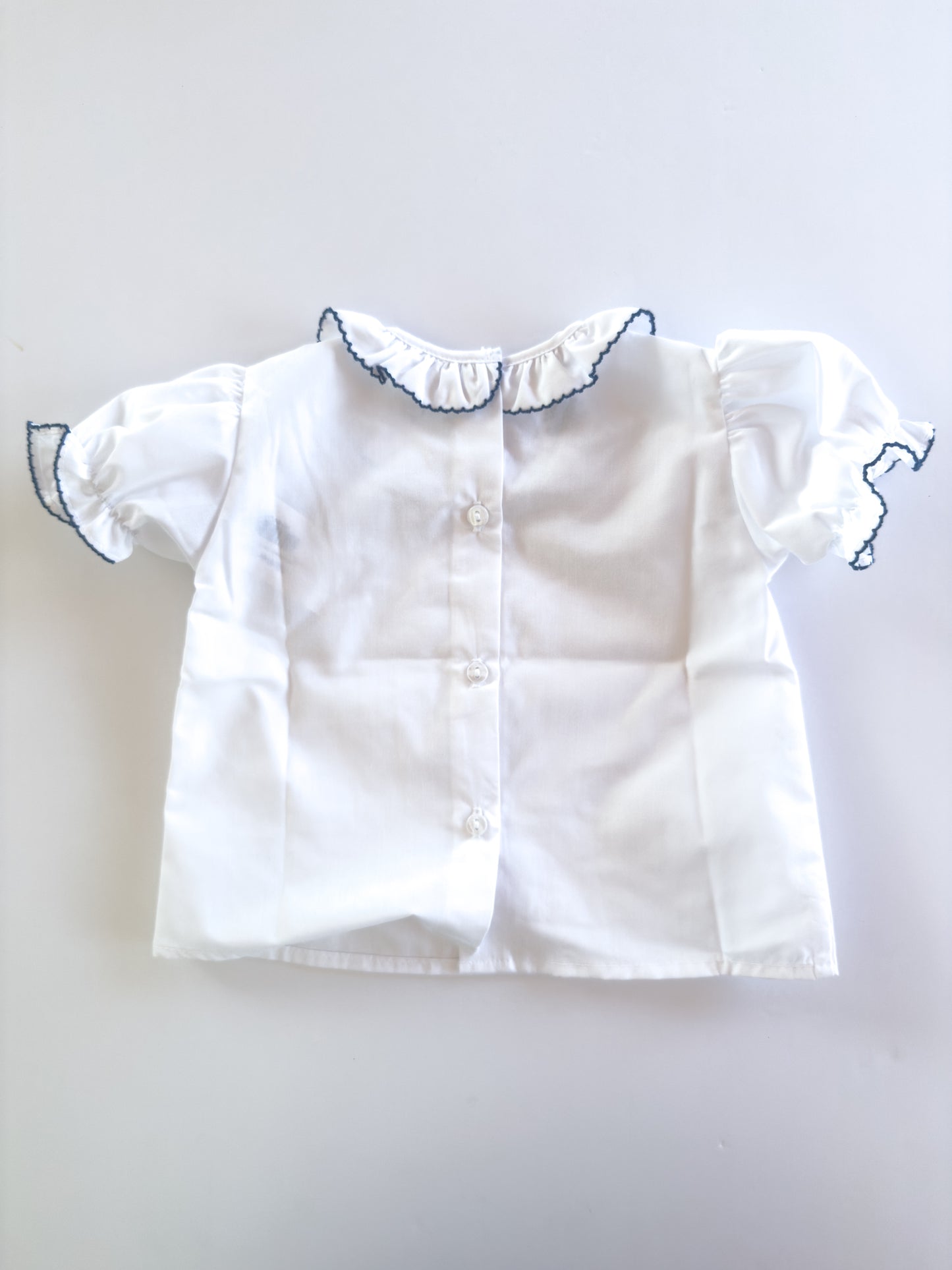 White/Navy Trim Ruffle Button Blouse