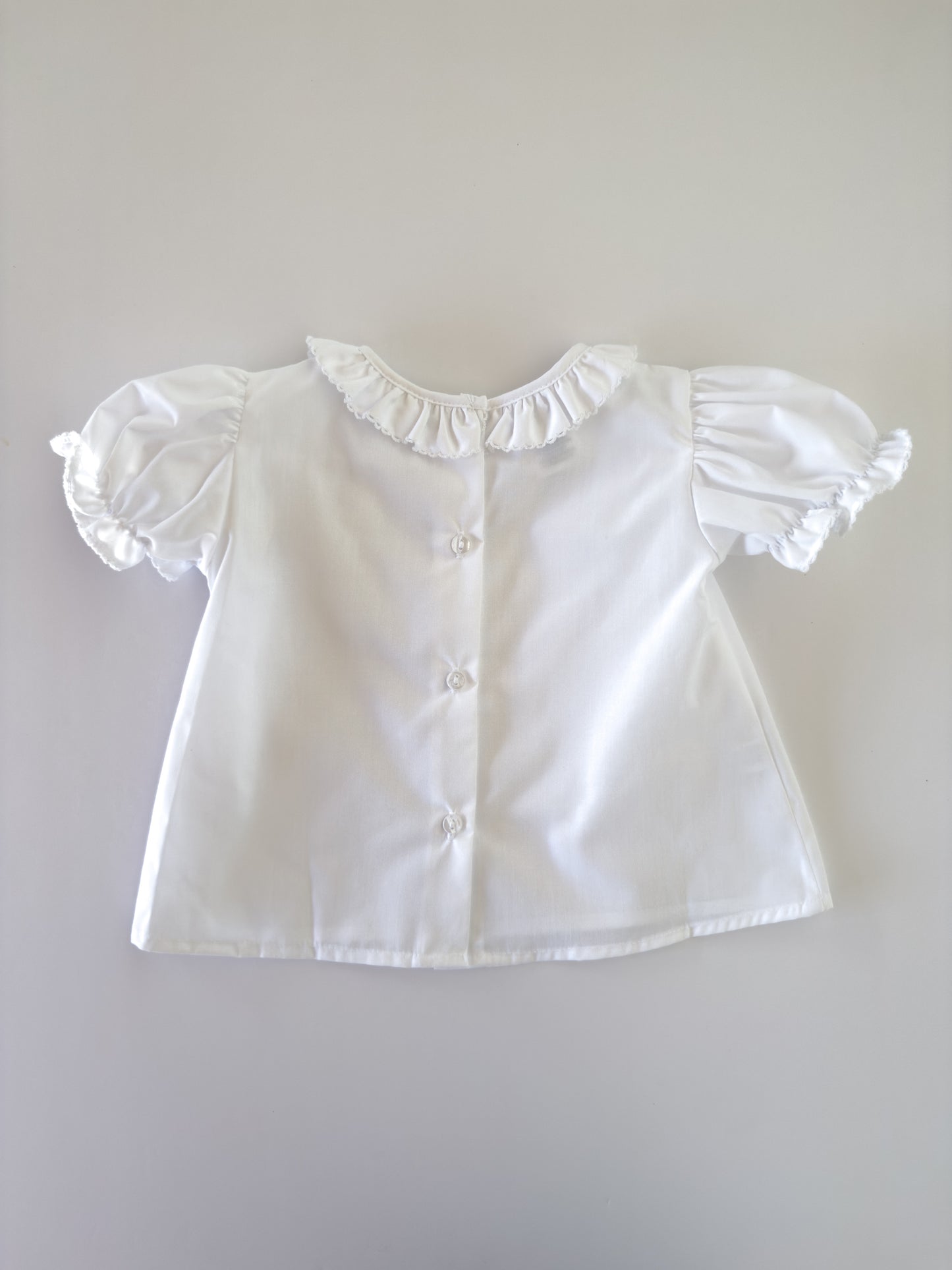 White Ruffle Button Blouse