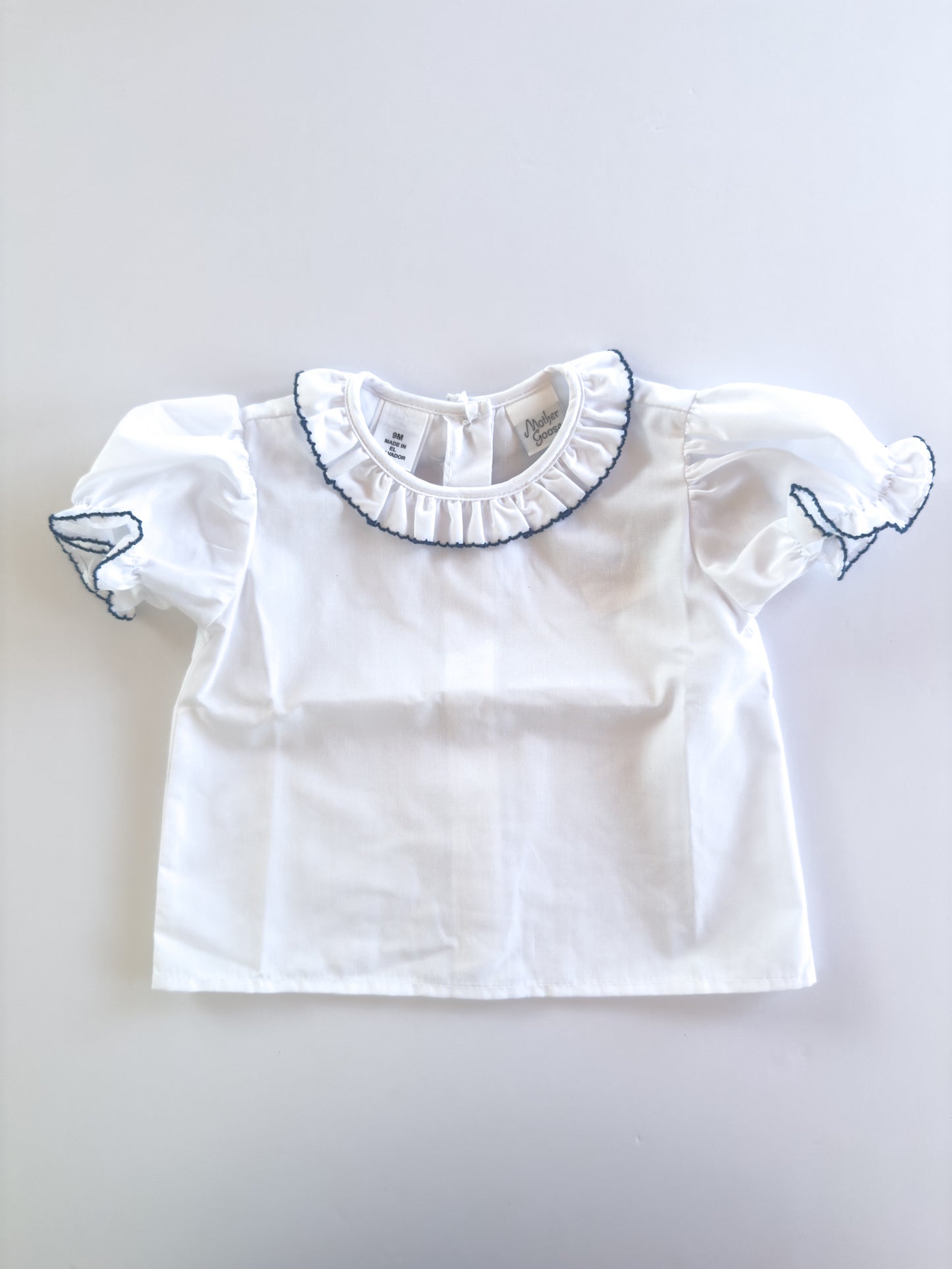 White/Navy Trim Ruffle Button Blouse